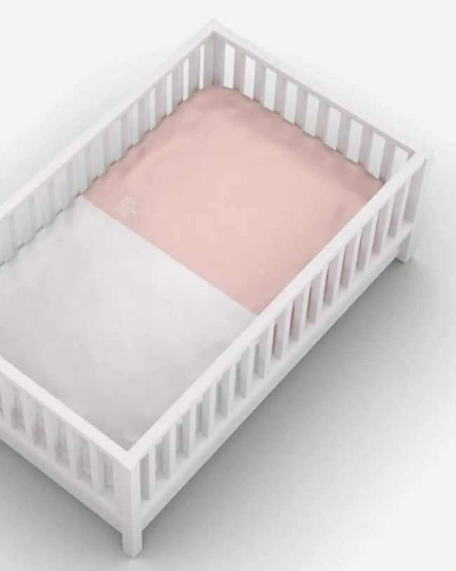 pink silk sheet on cot bed