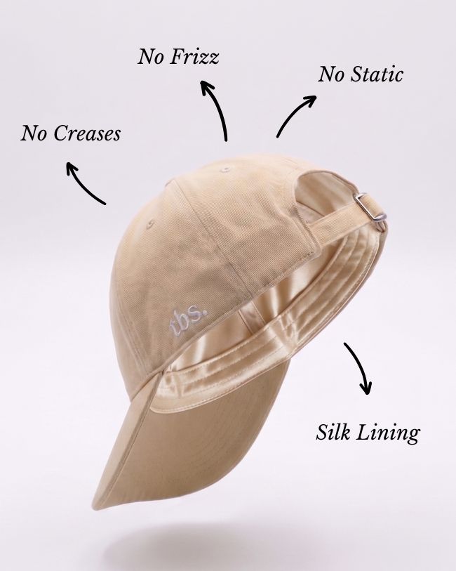 Beige bucket hat with silk lining on a light gray background