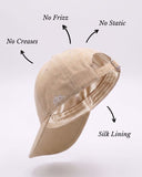 Beige bucket hat with silk lining on a light gray background